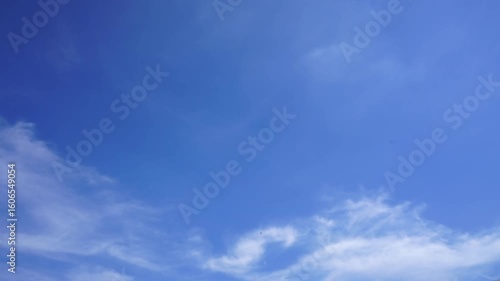 clouds and blue sunny sky,  white clouds over blue sky, Aerial view,  nature, blue sky, white clear weather. Time lapse video 4 K.