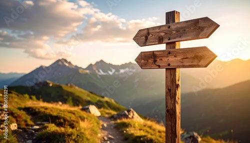 Wooden signpost in alpine landscape at sunset