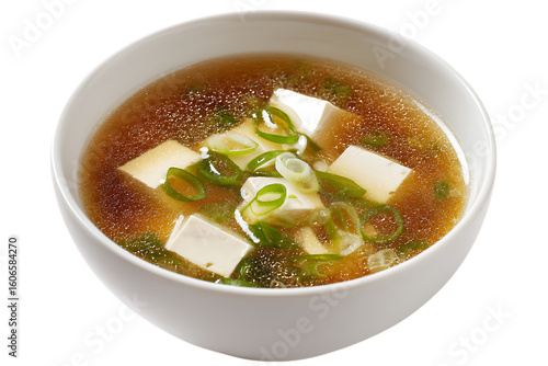On transparent background a closeup studio shot of a steaming bowl of japanese miso soup with cubed tofu wakame