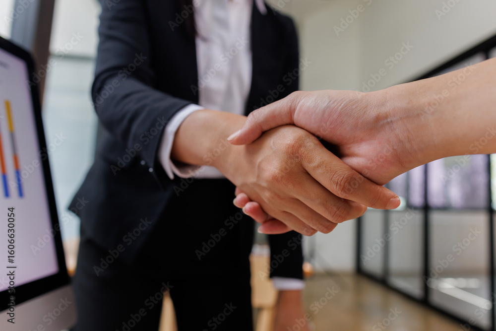 Obraz premium Business handshake for teamwork of business merger and acquisition,successful negotiate,hand shake,two businessman shake hand with partner to celebration partnership and business deal concept