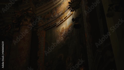 Ancient church fresco in the dim light of an old church in Dubrovnik and dimly lit chapel with intricate murals and golden details