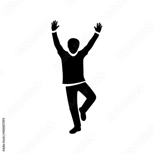 Silhouette of a young man dancing joyfully with arms raised  