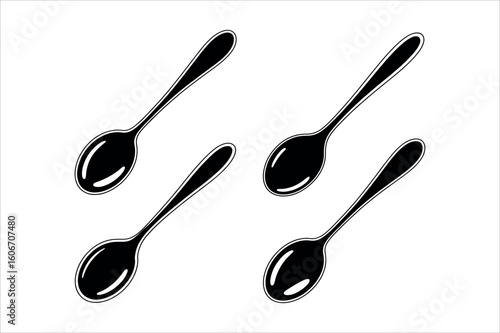 Four black spoons on white cutlery kitchenware