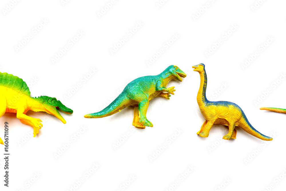 Fototapeta premium Plastic dinosaur toys on white background