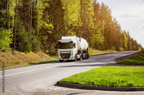 Wallpaper Mural Tank truck transports chemical product, liquefied gas, dangerous cargo. Beautiful summer sunny nature. Copy space for text Torontodigital.ca