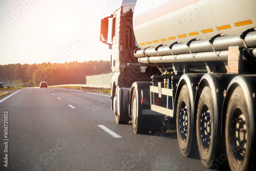 Wallpaper Mural A truck tractor with a tank semi-trailer is transporting a hazardous flammable cargo - fuel. Transportation of liquefied gas in a semi-trailer tanker on the road Torontodigital.ca