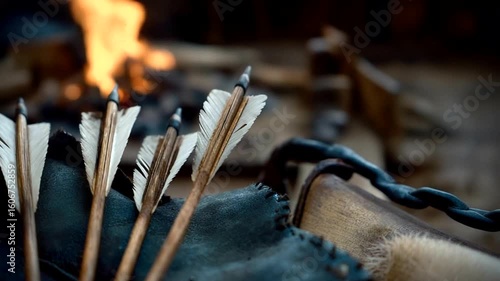 Medieval Archer's Arrows and Gear near Campfire in a Historical Setting, Dramatic Lighting