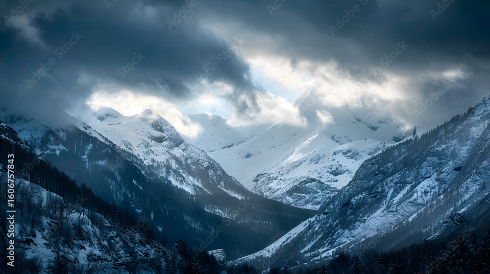 Obraz premium Snowy alpine mountain range with deep valley dram