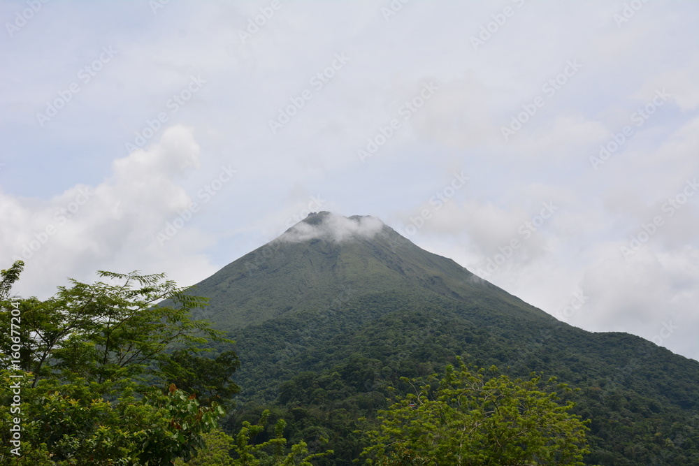 Fototapeta premium Arenal volcano with clouds on top (Costa Rica).