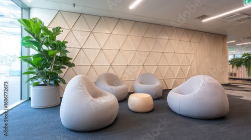 Modern office lounge with cozy seating, large windows, indoor plants, geometric wall design, contemporary furniture,