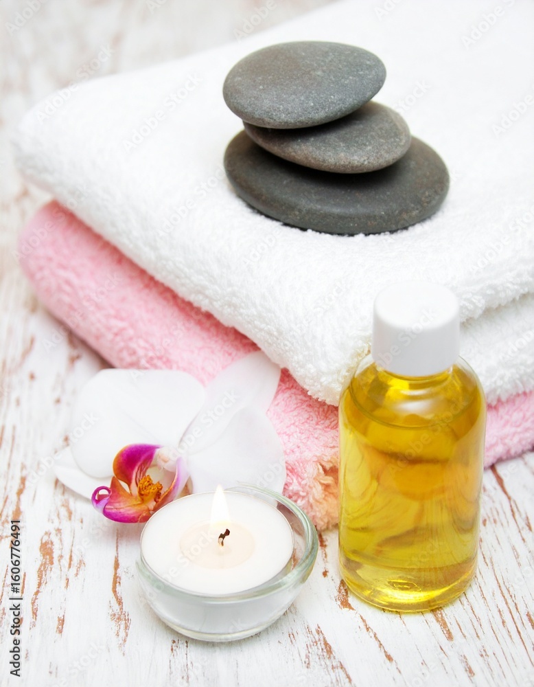 Spa Day Essentials: Towels, Stones, Oil, Candle & Orchid Spa Day Essentials: Towels, Stones, Oil, Candle & Orchid