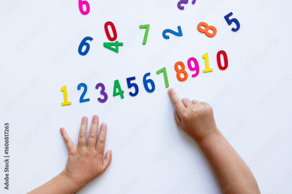 Fototapeta premium Children learning with colorful numbers on white background