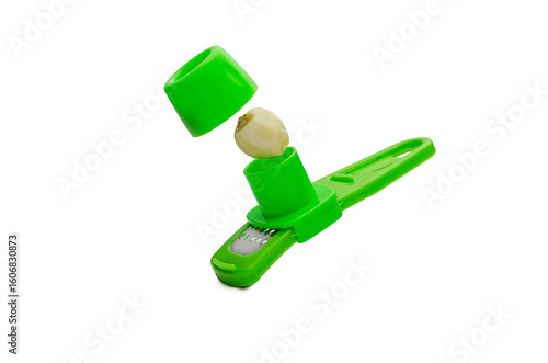 Garlic Press Tool with Clove Isolated on White Background