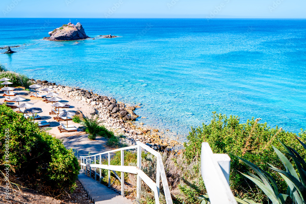 Fototapeta premium Stairs to the famous Aphrodite Beach on the Akamas Peninsula Neo Chorio near Latchi. The most beautiful places in Cyprus. The island's azure coast.