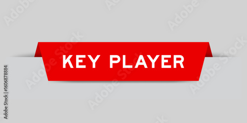 Red color inserted label with word key player on gray background