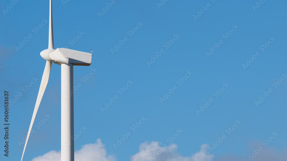 Wind turbine on blue sky with copy space Wind turbine on blue sky with copy space