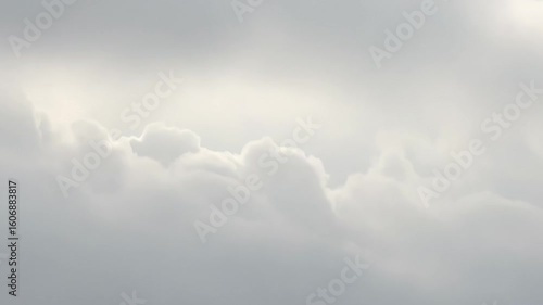 Ethereal Sky: A soft, dreamy expanse of cloud formations fills the frame, offering a serene and atmospheric view of the sky.