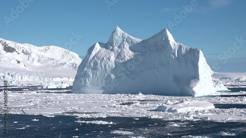 Wallpaper Mural Witness a stunning sunset casting warm hues over icy waters, illuminating floating icebergs in a peaceful Arctic setting. Nature showcases its breathtaking beauty. Torontodigital.ca