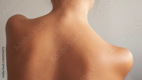 Woman applying body cream on arm, beauty skin care concept