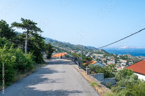 Fototapeta Naklejka Na Ścianę i Meble -  Street overlooking the small fishing village of Sveti Juraj on the Croatian coast