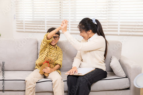 Bild auf Leinwand Therapy, child, counseling, psychologist, counselor joyful play with young boy s