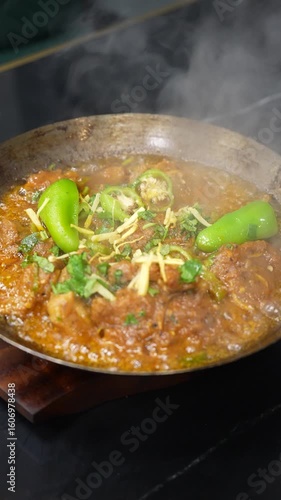 Steaming Authentic Pakistani/Indian Karahi Dish with Green Chilies and Ginger