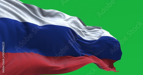 Close-up of Russia flag waving in the wind isolated on green background