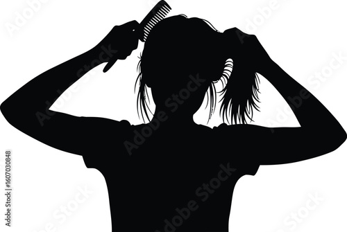 A silhouette of a woman is combing her hair.