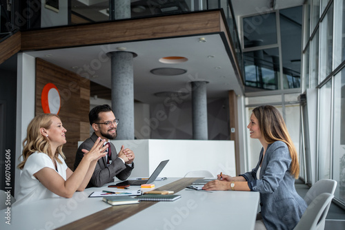 Managers interviewing candidate for job position in modern office