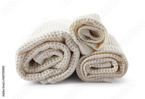 Clean rolled waffle towels isolated on white