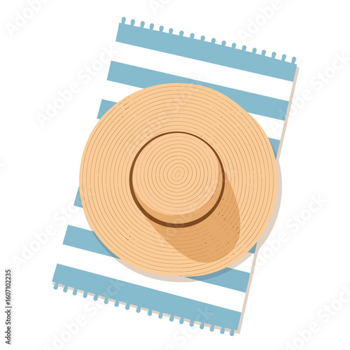 A woven sun hat rests on a blue and white striped beach towel.