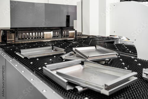 Photography Automatic metal sheet bending machine at work in factory