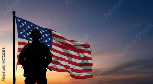 Soldier Silhouette Saluting American Flag at Sunset or Sunrise