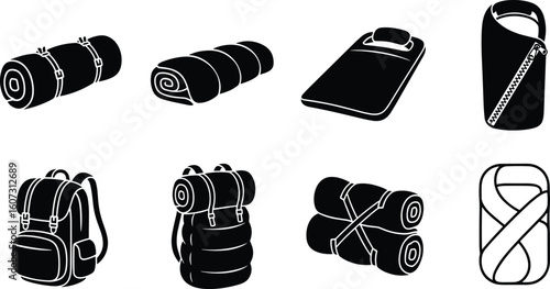 Set of camping and hiking gear including sleeping bags and rolled up backpacks for outdoor adventures