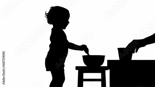 Silhouette of a toddler playing with a bowl on a stool next to a hand reaching for a cup on a table | editable eps vectors