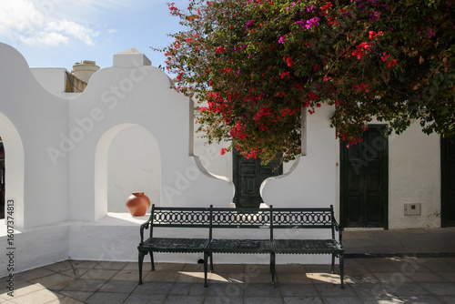 bench and bougainvillea in the square in Haria, Lanzarote, Canary Islands, Spain