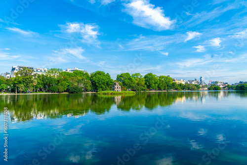 View of Turtle Tower at Hoan Kiem Lake in spring with beautiful reflection, an important historical building in Hanoi, Vietnam