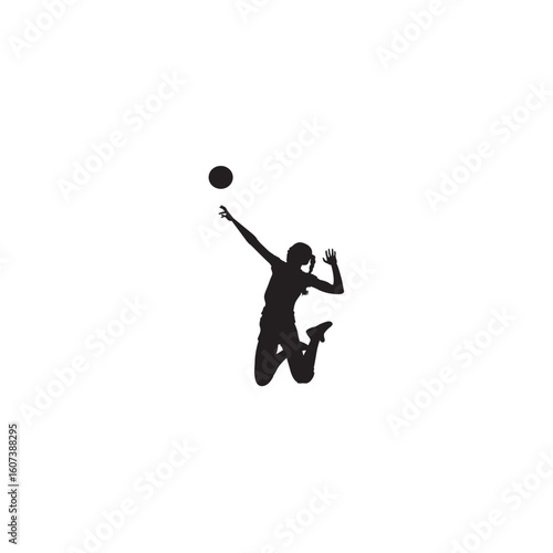 Silhouette of young woman playing volleyball jumping to spike the ball