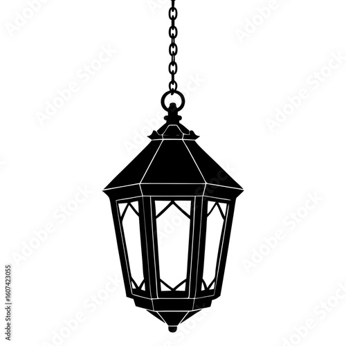 A vintage black lantern hanging from a chain, isolated on a white background