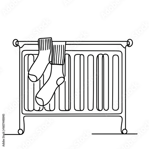 Two socks drying on radiator