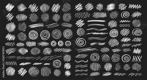 A diverse collection of white textured brush strokes and scribble elements on a black background representing artistic abstract designs