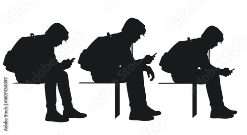 Silhouetted individuals seated on a bench engrossed in their mobile phones a common sight in modern public spaces