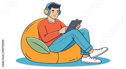 Man wearing headphones using tablet on beanbag sitting