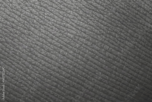 Close-up of gray leather texture with geometric diamond pattern, perfect for backgrounds, material design, and realistic textile concepts.