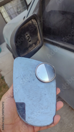 Broken driver's rearview mirror, damaged left rearview mirror.