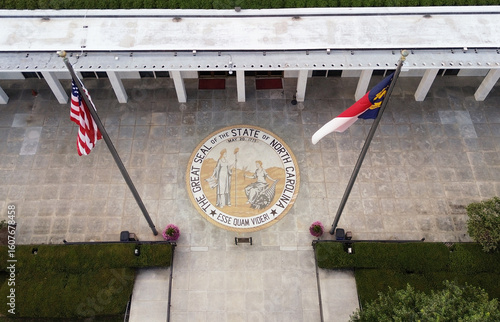 Aerial view of the North Carolina State legislature building with the state seal at the entrance