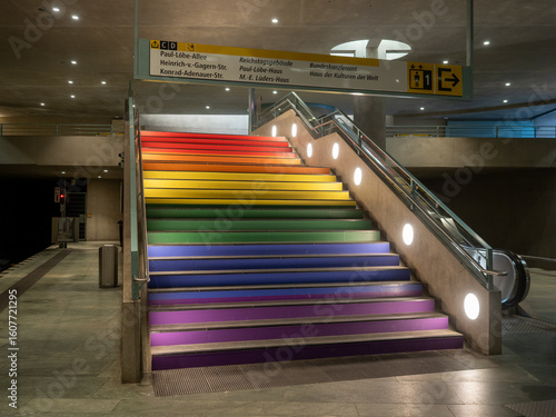Berlin, Germany - July 25, 2025: Bundestag BVG metro station stairs are painted in rainbow colors resembling LGBTQ pride flag