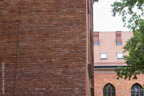 Brick Wall and Tiled Roof of an Old European Building