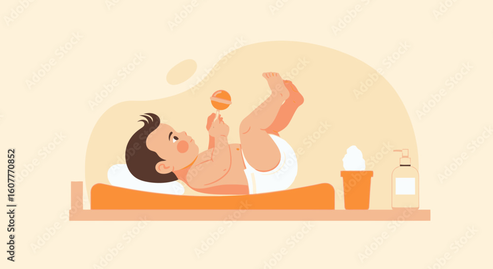 Obraz premium Happy Infant Lying Down Holding A Rattle With Diaper And Body Care Products