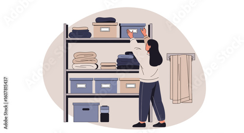 Woman Organizes Linen Closet With Towels And Storage Boxes For Home Interior